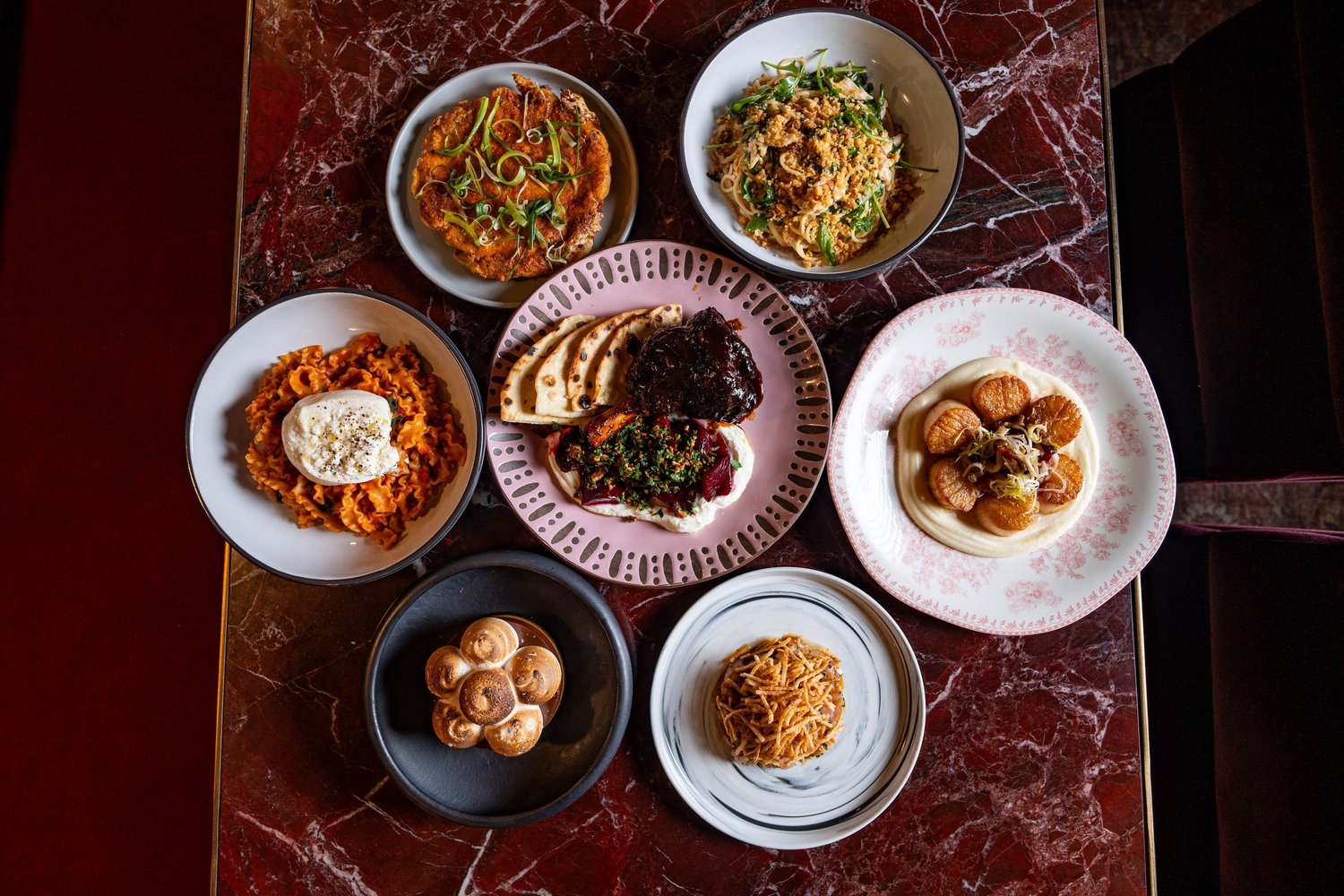 A spread of Mileta dishes: pasta, sourdough pancake and scallops